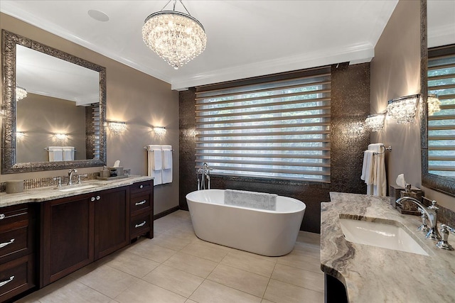 full bath with crown molding, a soaking tub, tile patterned floors, two vanities, and a chandelier