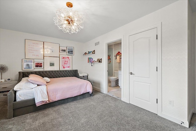 bedroom with carpet floors, a chandelier, ensuite bath, and baseboards