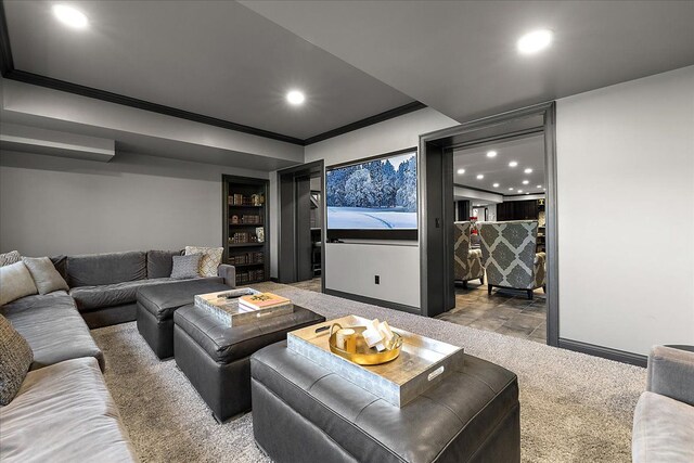 carpeted cinema with recessed lighting, ornamental molding, and baseboards