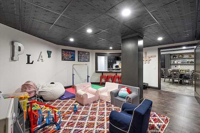 game room featuring wood finished floors, baseboards, and recessed lighting