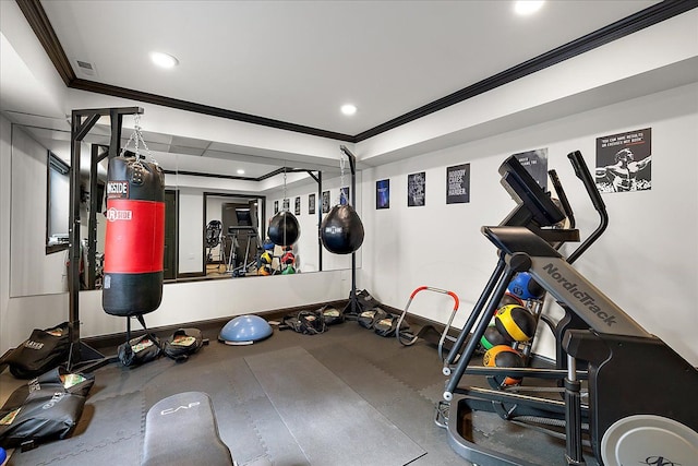 exercise room featuring ornamental molding and recessed lighting