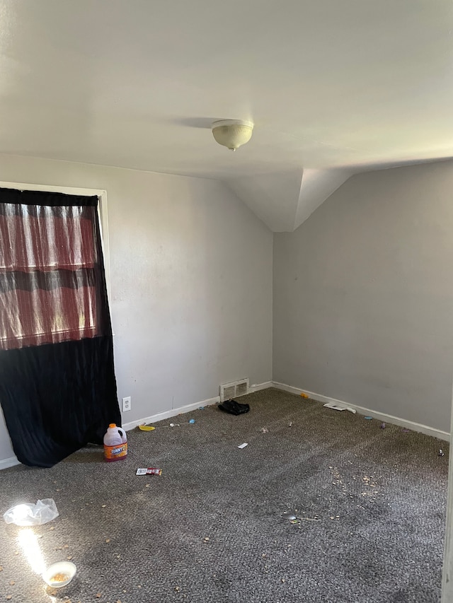 bonus room featuring lofted ceiling, baseboards, and carpet flooring