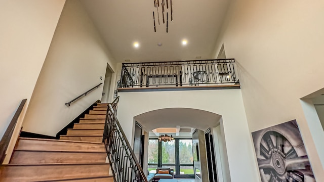 47490 Bellagio Dr, Northville, MI 48167 - stairs with a high ceiling and arched walkways