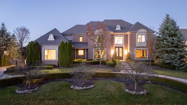 47490 Bellagio Dr, Northville, MI 48167 - view of front of house featuring brick siding and a front lawn