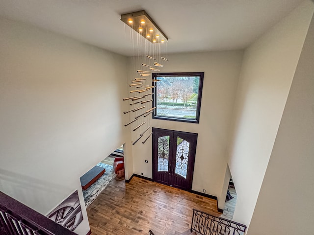 47490 Bellagio Dr, Northville, MI 48167 - foyer featuring wood finished floors, baseboards, stairway, and french doors