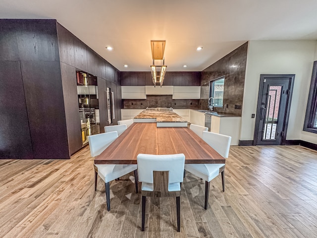 47490 Bellagio Dr, Northville, MI 48167 - dining area featuring light wood finished floors, recessed lighting, and baseboards