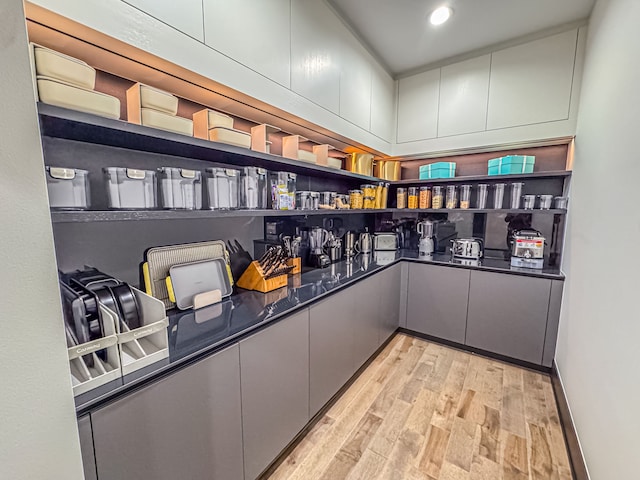 47490 Bellagio Dr, Northville, MI 48167 - bar with light wood finished floors