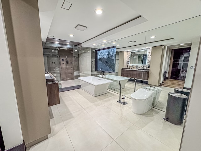 47490 Bellagio Dr, Northville, MI 48167 - bathroom featuring a shower stall, two vanities, a freestanding bath, recessed lighting, and tile patterned flooring
