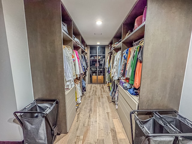 47490 Bellagio Dr, Northville, MI 48167 - walk in closet with light wood-style flooring