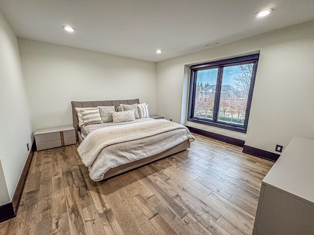 47490 Bellagio Dr, Northville, MI 48167 - bedroom featuring wood finished floors, recessed lighting, and baseboards