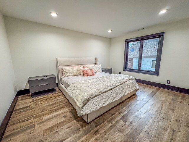 47490 Bellagio Dr, Northville, MI 48167 - bedroom with wood finished floors, recessed lighting, and baseboards