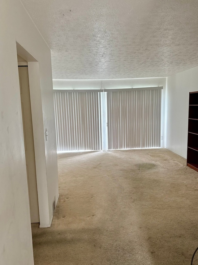 1349 Cherrylawn Dr, Pontiac, MI 48340 - unfurnished living room featuring carpet floors and a textured ceiling