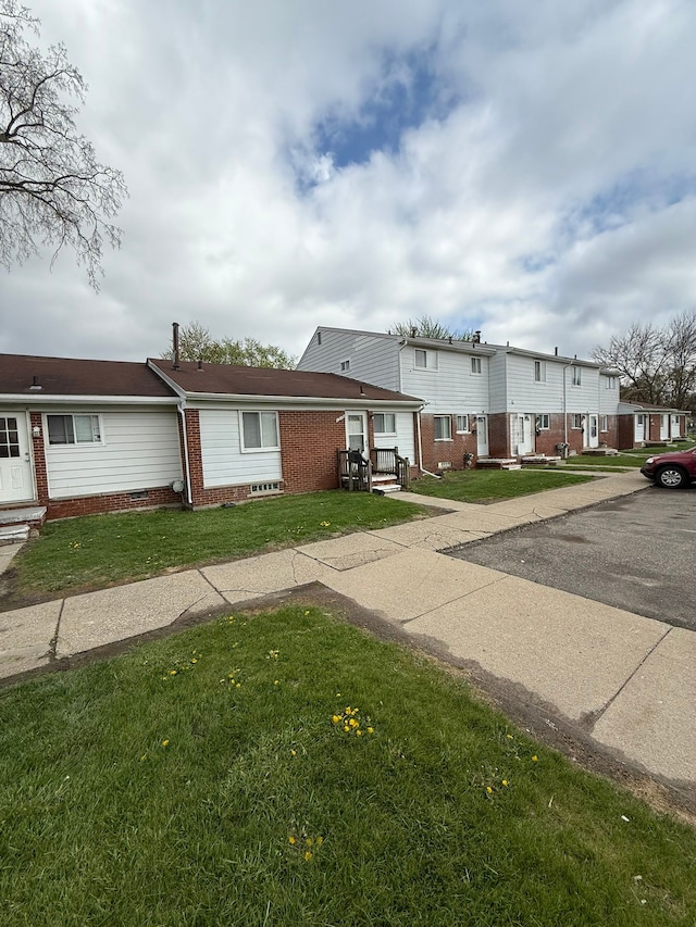 1349 Cherrylawn Dr, Pontiac, MI 48340 - townhome / multi-family property with brick siding and a front lawn