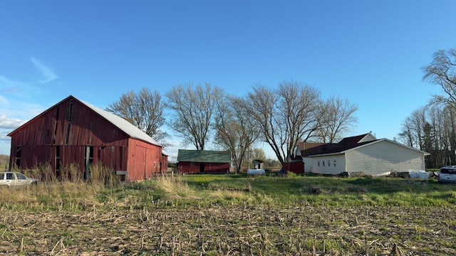view of yard with a barn and an outdoor structure