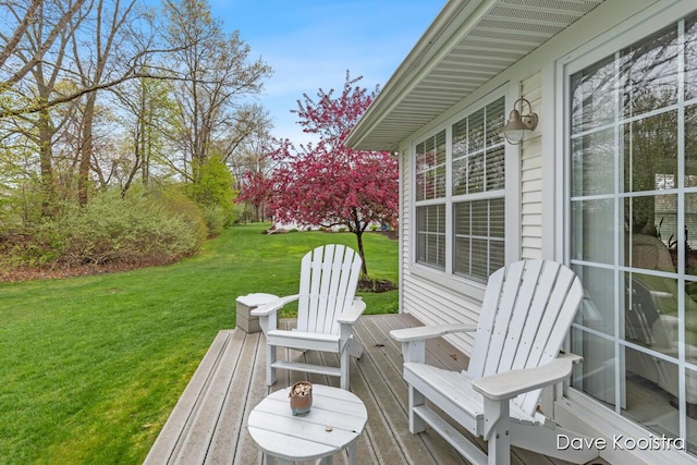 wooden terrace with a yard
