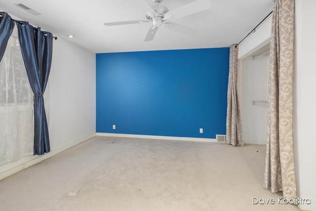 unfurnished bedroom featuring carpet flooring, baseboards, a ceiling fan, and recessed lighting