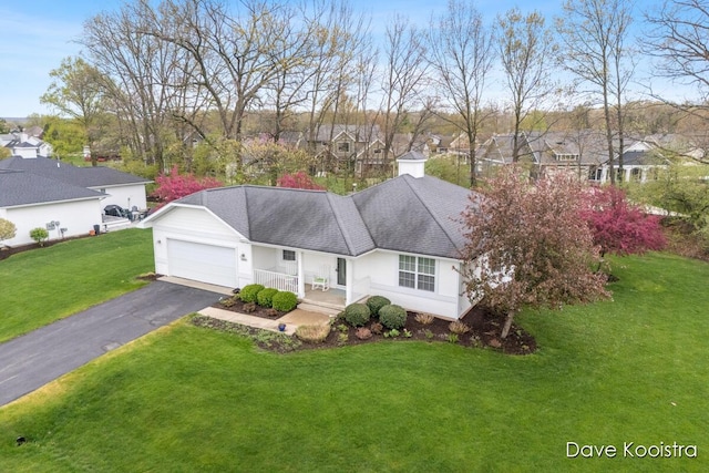 single story home featuring a front yard, asphalt driveway, an attached garage, a residential view, and a shingled roof