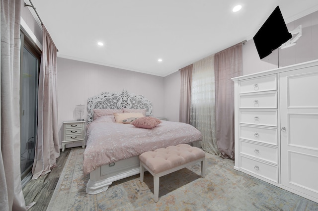 bedroom featuring ornamental molding, recessed lighting, and light wood finished floors