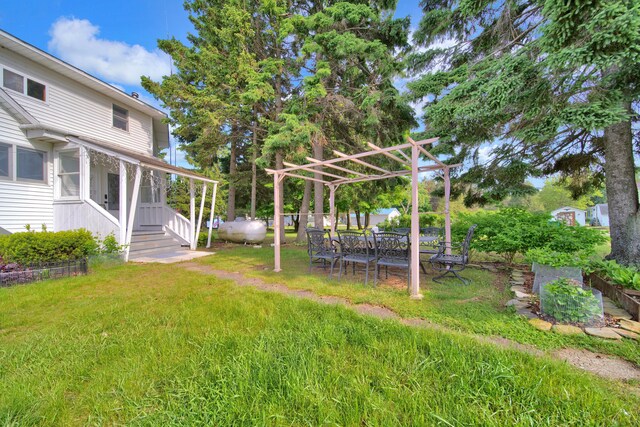 view of grassy yard featuring a pergola