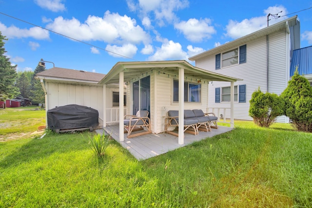 rear view of property featuring a yard