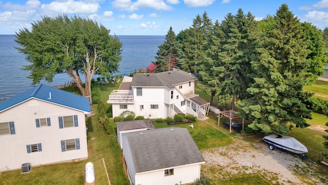 aerial view of property and surrounding area with a large body of water