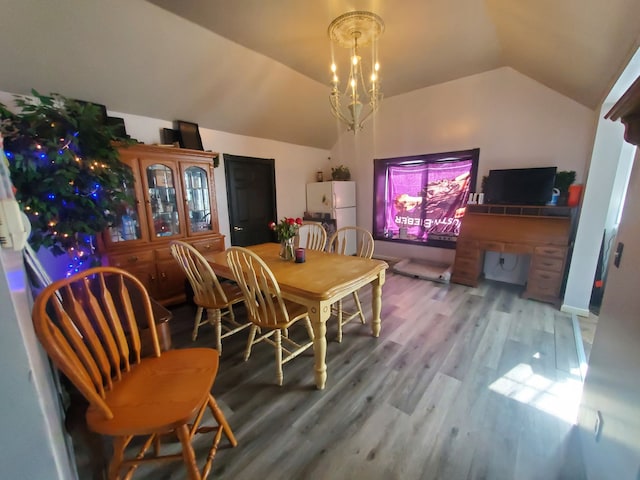4235 Vine St, Brown City, MI 48416 - dining room featuring vaulted ceiling and wood finished floors