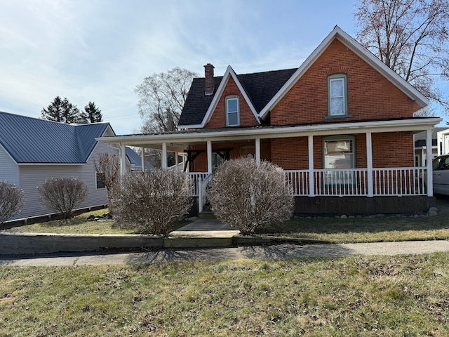 4235 Vine St, Brown City, MI 48416 - country-style home with a chimney, covered porch, and a front yard