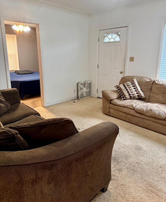living area with light colored carpet
