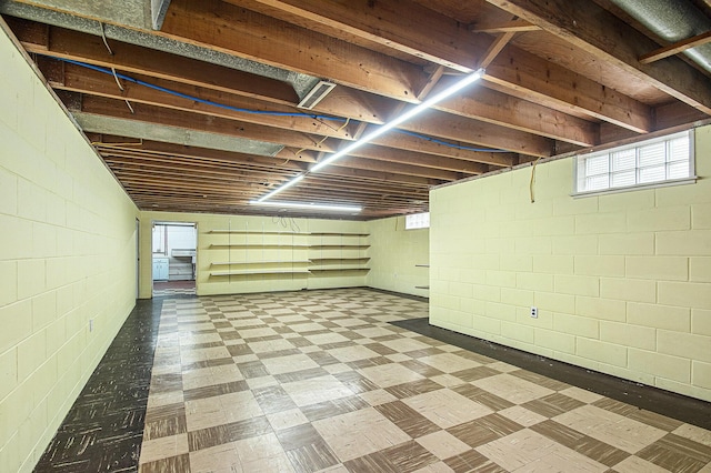 2228 Washington Ave, Saint Joseph, MI 49085 - basement featuring tile patterned floors and concrete block wall