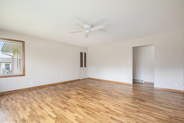 2228 Washington Ave, Saint Joseph, MI 49085 - unfurnished room with light wood finished floors, ceiling fan, and baseboards