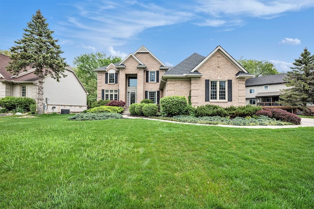 1079 Trailside Blvd, Wixom, MI 48393 - view of front of house with a front yard and brick siding