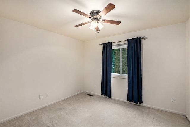 1079 Trailside Blvd, Wixom, MI 48393 - spare room with light colored carpet, ceiling fan, and baseboards