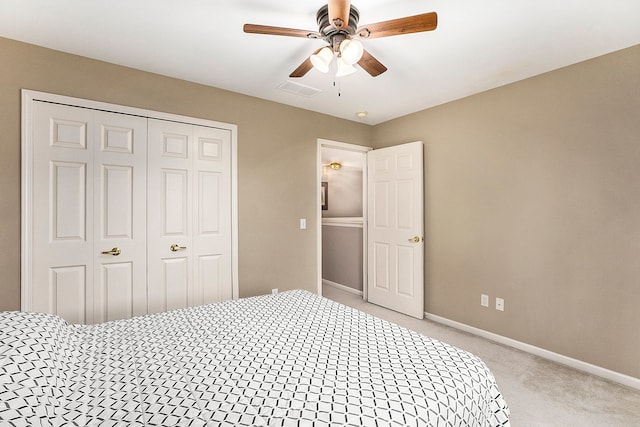 1079 Trailside Blvd, Wixom, MI 48393 - bedroom featuring light colored carpet, a closet, baseboards, and a ceiling fan