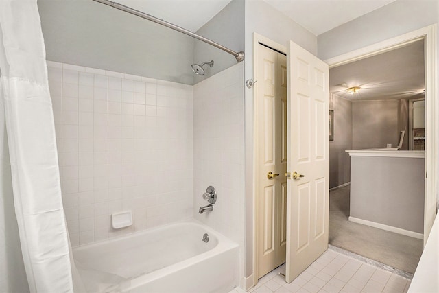 1079 Trailside Blvd, Wixom, MI 48393 - bathroom featuring tile patterned flooring, shower / bath combination with curtain, and baseboards