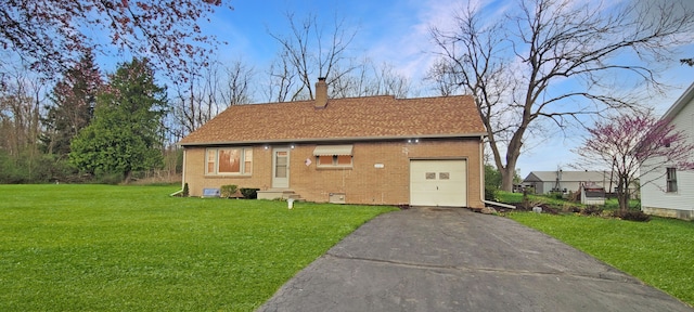 2127 E Coldwater Rd, Flint, MI 48505 - rear view of property with brick siding, a yard, driveway, a chimney, and a garage