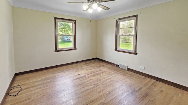 2127 E Coldwater Rd, Flint, MI 48505 - spare room featuring light wood-style flooring, ceiling fan, and baseboards