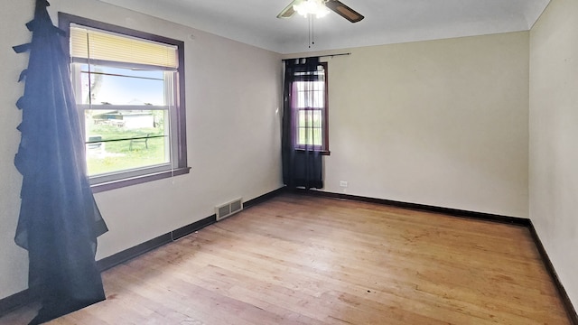 2127 E Coldwater Rd, Flint, MI 48505 - empty room featuring wood finished floors, baseboards, and a ceiling fan