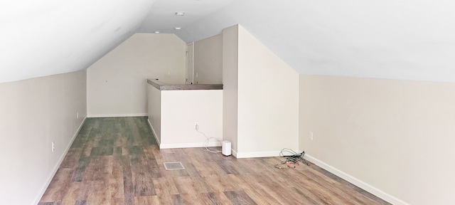 2127 E Coldwater Rd, Flint, MI 48505 - bonus room featuring wood finished floors, lofted ceiling, and baseboards