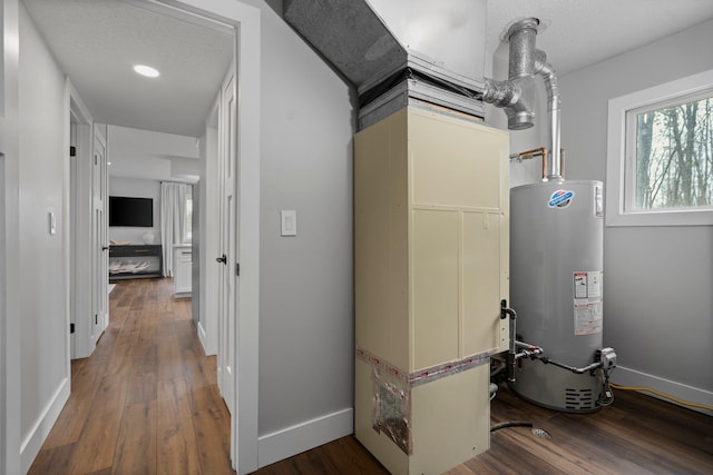 utility room with gas water heater