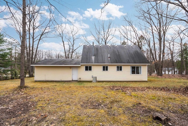 rear view of house with a lawn