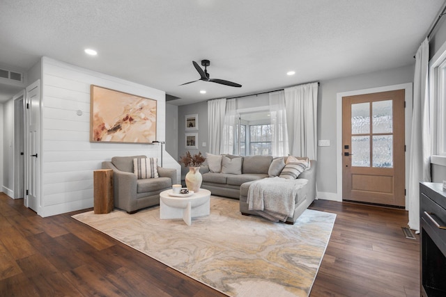 living area featuring ceiling fan, dark wood-style floors, healthy amount of natural light, recessed lighting, and baseboards