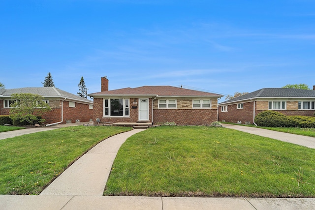 8373 Mckinley, Center Line, MI 48015 - view of front facade featuring a chimney, a front lawn, and brick siding