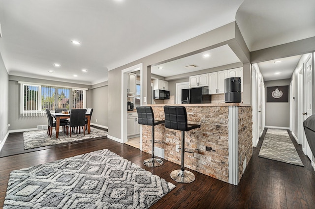 8373 Mckinley, Center Line, MI 48015 - kitchen featuring black appliances, baseboards, white cabinetry, dark wood-style floors, and light countertops