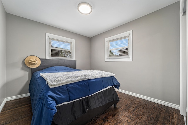 8373 Mckinley, Center Line, MI 48015 - bedroom featuring baseboards and wood finished floors