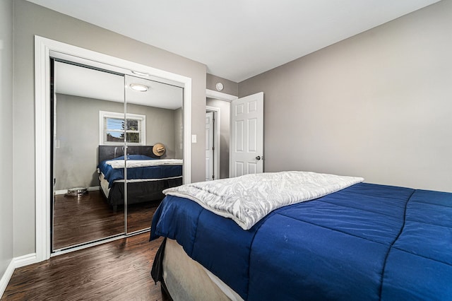 8373 Mckinley, Center Line, MI 48015 - bedroom featuring dark wood-style floors, a closet, and baseboards