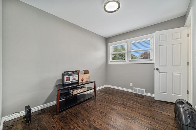 8373 Mckinley, Center Line, MI 48015 - miscellaneous room with baseboards and dark wood-style flooring