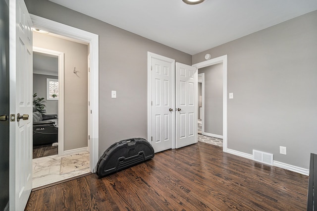 8373 Mckinley, Center Line, MI 48015 - bedroom featuring baseboards, wood finished floors, and a closet