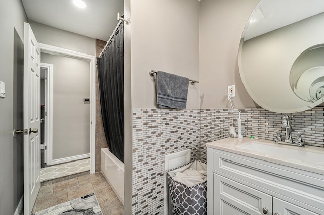 8373 Mckinley, Center Line, MI 48015 - bathroom featuring vanity, shower / bathtub combination with curtain, and stone finish floors
