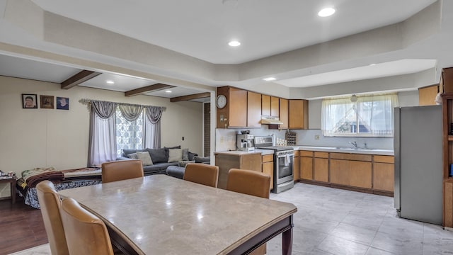 dining space featuring beam ceiling and recessed lighting