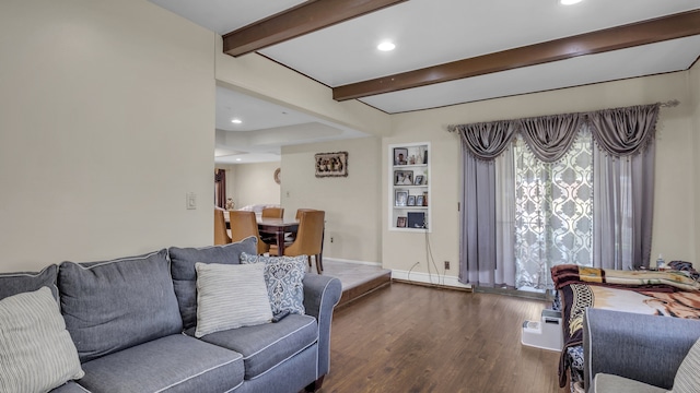 living area with beamed ceiling, wood finished floors, healthy amount of natural light, recessed lighting, and baseboards